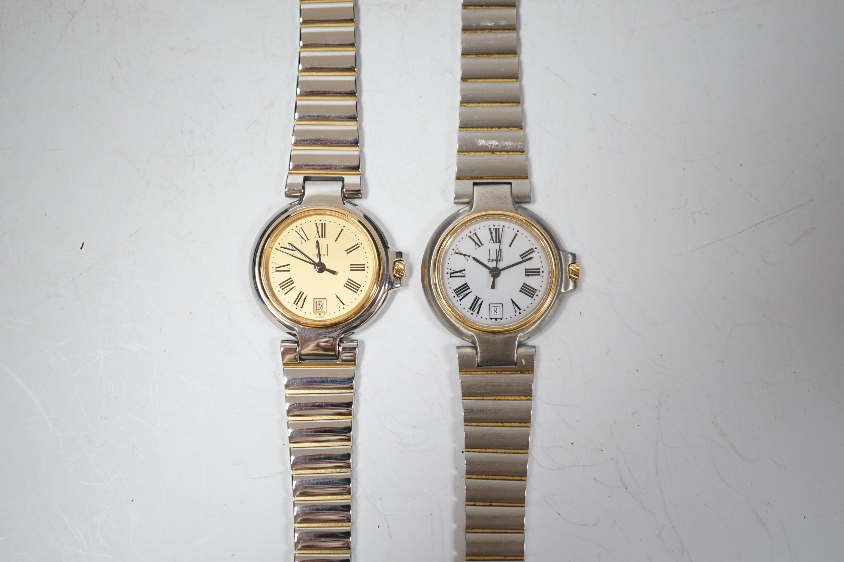 Two lady's steel and gold plated Dunhill quartz wrist watches, one with Dunhill box.